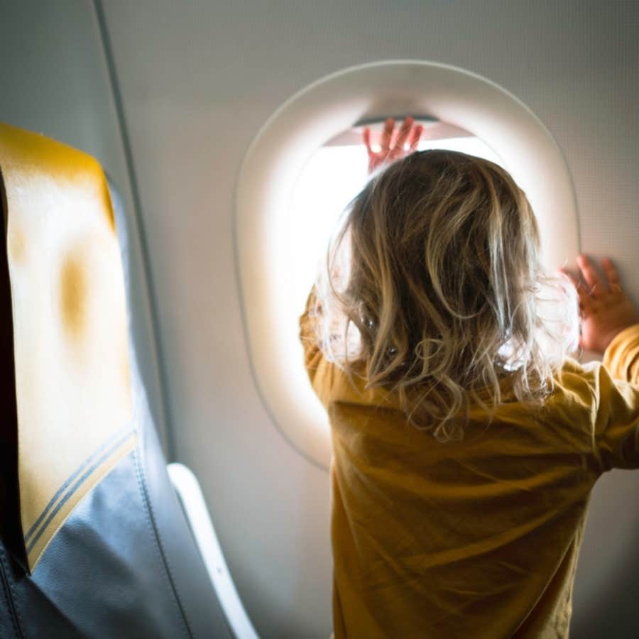 woman asks mother to calm her child down on flight